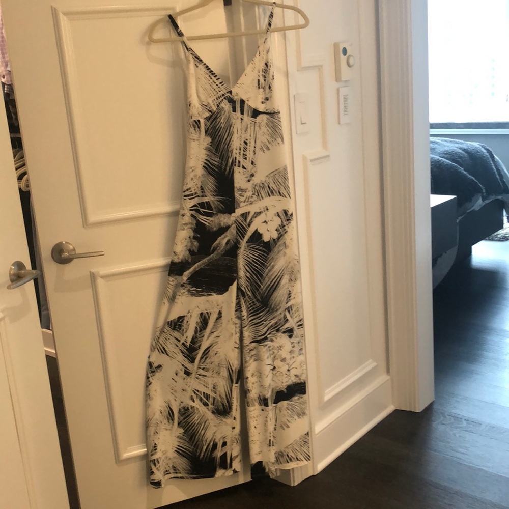 Woman’s strap jumpsuit in a classic Norma Kamali pattern.